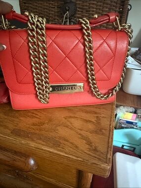 CHANEL Quilted Coral Shoulder Bag with Gold Chain Detail